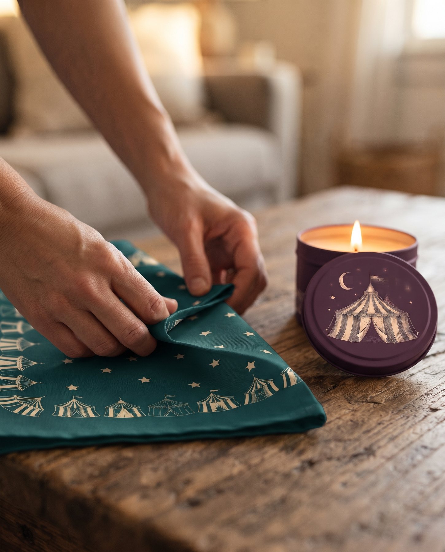 Circus-print cushion covers, a candle tin and a folded tea towel from Urdaneta Innovations